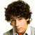 Pixelated image of a person with curly brown hair wearing a light jacket over a red shirt, next to text reading 'the cute one' and a pink heart symbol.