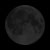 A pixelated grayscale circle with uneven shading against a solid black background, appearing as a low-resolution moon or celestial body.