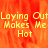 A pixelated image with orange and red flame-like background displaying yellow text reading "Laying Out Makes Me Hot" in three lines.