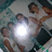 A static pixelated image shows multiple figures in a circular arrangement around a bright central light source, with muted background tones.