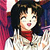 Pixelated image of a person with dark hair, red scarf, and light-colored top against a multicolored background.