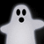 Pixelated white ghost with black eyes and mouth on dark background, arms extended horizontally.