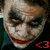 A pixelated image of a character with white face paint, dark eye makeup, and red lips in three distinct poses.