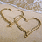 Two heart outlines drawn in sand with text reading 'All I Want Is 2 Stay Wit You 4EVER!!' on a beach background.
