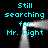 Cyan text 'Still searching for Mr. Right' repeated in four corners around a central glowing white frame on black background.