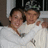 A four-quadrant image with a photo of two people in white clothing, text reading "I Love When You Call Me Baby," and names/dates on black backgrounds.