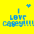 Yellow background with blue pixelated text "I LOVE CASEY!!!!!" and animated blue heart or starburst symbols above the text.