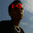 A person in a black shirt and white necklace against a blue sky background with red text overlays changing across frames.