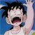 Pixelated image of a character with spiky black hair, open mouth, and raised arm against blue background.