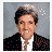 Animated sequence of pixelated portraits with text overlays including 'VOTE', 'KERRY', and 'CARRIE' over a gray background.