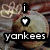 Pixelated icon with vertical text 'i' and heart symbol above bold lowercase 'yankees' on a blurred background.