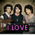 Three people stand side-by-side against a textured brown background with pink text reading "I LOVE JONAS BROTHERS!" below them.