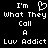 Black background with white pixelated text reading "I'm What They Call A Luv Addict" and a heart symbol replacing the 'u' in Luv.
