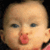 A pixelated contact sheet showing a baby's face on the left and red text reading "KISS ME CUTIE" on the right, with two sampled frames from an animated icon.