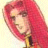 Pixelated image of a person with long red hair, light skin tone, and dark eye makeup wearing a yellow garment against a pale background.