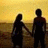 Silhouetted couple holding hands on a beach at sunset, with text overlay changing from 'i wish he knew' to blank.