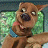 A 48x48 pixel buddy icon featuring a split composition with Scooby-Doo on the left and promotional text for 'Scooby Doo 2' on the right, rendered in low-resolution pixel art style.