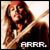 A pixelated image of a person with long brown hair holding an object near their face, with text reading "ARRR." at the bottom.