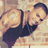 A pixelated image of a person in a dark sleeveless top against a brick wall, with text overlays reading "Chris Brown" and "I Love You!" on black and gray backgrounds.