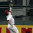 Pixelated image of a baseball player in white uniform reaching upward, with red text reading 'AARON ROWAND' and 'HE CAN CATCH ANYTHING'.