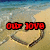 Beach scene with heart drawn in sand; text overlays change from red 'our love' to green 'can't be washed away'.
