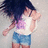 A person with long dark hair wears a white tank top and blue denim shorts, captured in three sequential poses showing motion.
