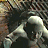 Pixelated image split into two sections: left shows a figure in white clothing with arms raised against dark background, right displays 'DOOM 3' text in fiery orange-yellow gradient on black.