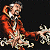 A pixelated figure in an orange jacket holds a microphone against a dark background, with green text reading 'Original Icons .com' on the right.