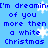 Blue background with blue pixelated text repeating 'I'm dreaming of you more than a white Christmas' and scattered white snowflakes.
