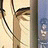 Pixelated anime-style character face with closed eyes and light brown hair, next to black background with white text reading 'AnimeIM' and 'com'