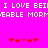 Pixelated text on bright pink background with red and pink heart symbols below.