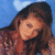 A pixelated image of a person with long brown hair against a blue background, next to green text reading 'Original Icons .com' on dark green.