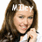 A pixelated image of a woman with long brown hair smiling, wearing a white top with a black collar, with text above her head changing from 'Miley' to 'Rules'.