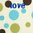Animated icon with blue text 'love' and 'me', green, brown, and light blue circles on a beige background; the heart symbol changes from solid to broken.