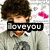Pixelated image of a person with dark curly hair wearing a light gray jacket over red clothing, with 'LOVE YOU' text overlay and pink heart shapes in the background.