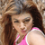 Static 50x50 pixel icon showing a woman with long brown hair wearing a pink sleeveless top against a blurred background.