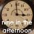 A pixelated clock face with brown hour and minute hands showing nine minutes past nine, overlaid with white text reading 'nine in the afternoon' on a dark background.