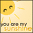 Yellow sun with closed eyes and smiling mouth on beige background, text "you are my sunshine" below.