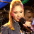 A pixelated contact sheet showing two frames of an animated icon featuring a woman with long blonde hair holding a microphone on the left and green text reading "Original Icons .com" on a dark green background on the right.