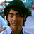 A person wearing a dark green hat and light blue shirt appears in three with subtle facial expression changes