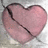 A four- pixel art composition with a cracked pink heart, text fragments on black backgrounds, and gray space
