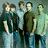 Pixelated group of five people on left, repeated "Relient K" text on top right, "Rules!!!" text on bottom left, green and gray background.