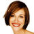 Pixelated close-up of a person with short brown hair, light skin, and red lips smiling against a white background.