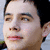 A four- shows a person's face with subtle expression changes , set against an outdoor background