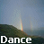 Animated sequence of a rainbow over hills with text forming 'Dance With Me In The Rain' where 'Rain' changes from white to blue.