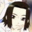 A 48x48 pixel buddy icon featuring a cartoon-style character with shoulder-length brown hair and a white top, alongside text reading "Anime IM" and "COM" on a black background.