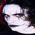 Animated sequence showing a character with pale skin, dark hair, and red eyes transitioning from closed to open mouth expressions.