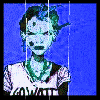 A pixelated figure with blue-green skin and dark hair wears a white shirt with green collar against a blue background, with 'TANK GIRL' text below.