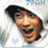 Pixelated image of a person with dark hair smiling broadly, wearing light-colored clothing against a white background with faint blue elements.