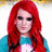 Pixelated static image of a person with long red hair wearing a blue top against white background.